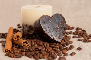 aroma handmade soap and candle and coffee beans on the canvas