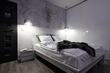 Beton architektoniczny na ścianie w sypialni
