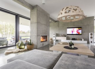 Spacious cozy living room with big windows and fireplace